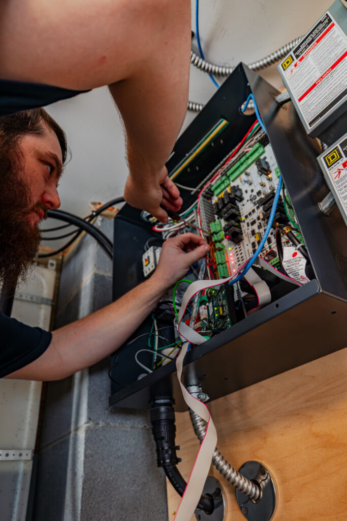 Professional home elevator maintenance in Charleston checking for salt air corrosion