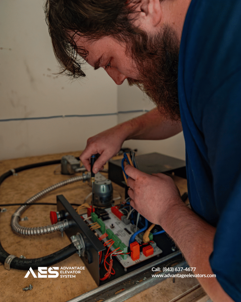 Residential elevator service Charleston technician performing maintenance on lift system